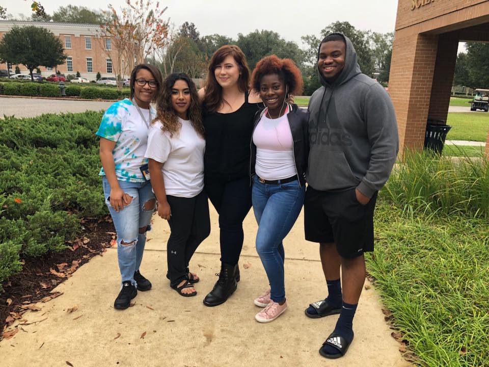Group of students in front of the science building at the Perkinston Campus