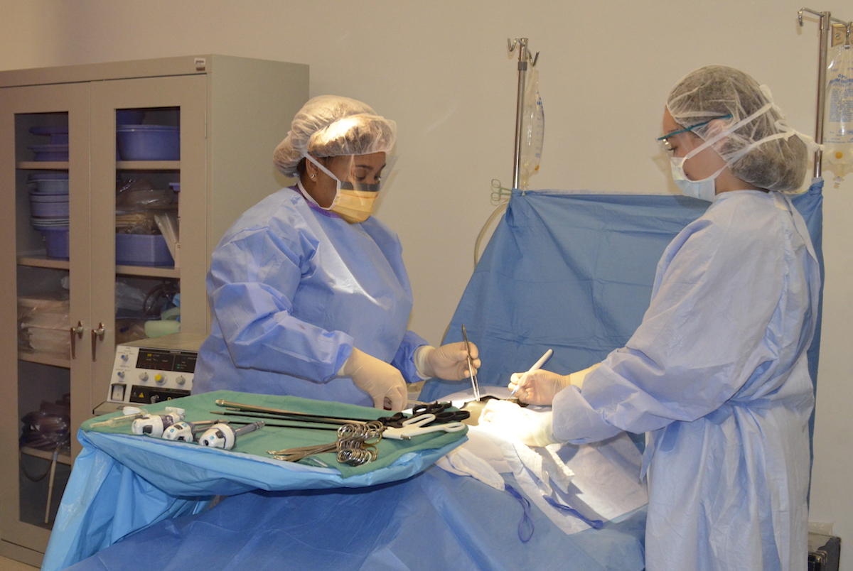 surgical technology students operating