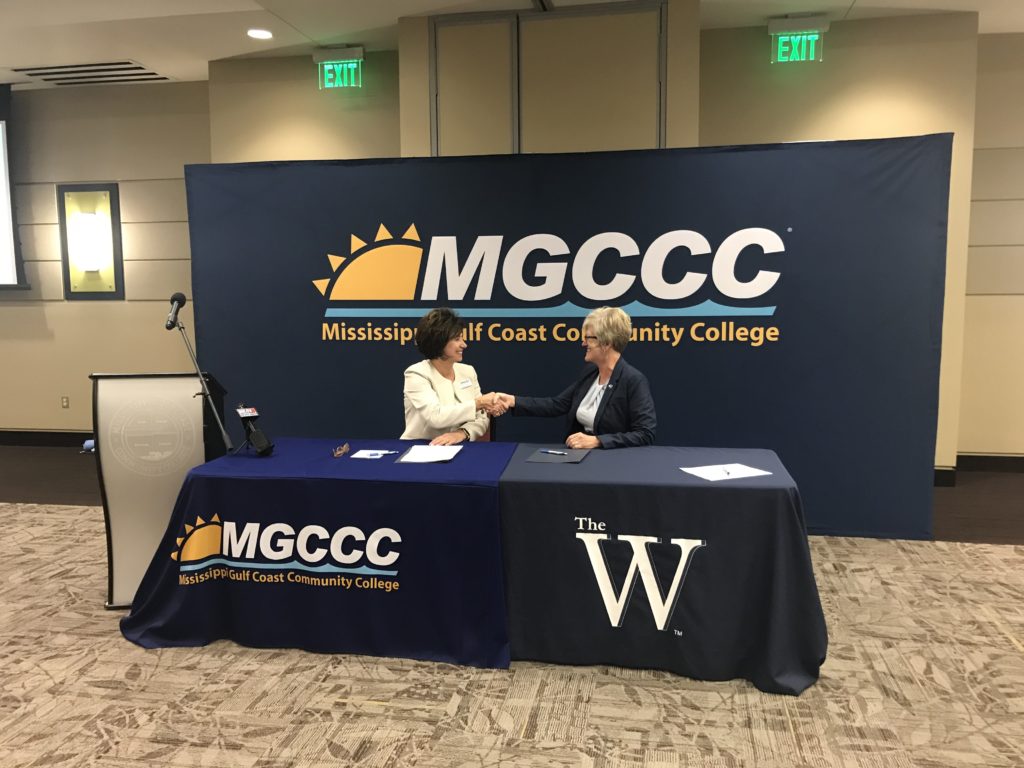 MGCCC President Dr. Mary S. Graham and MUW President Nora Miller shaking hands.