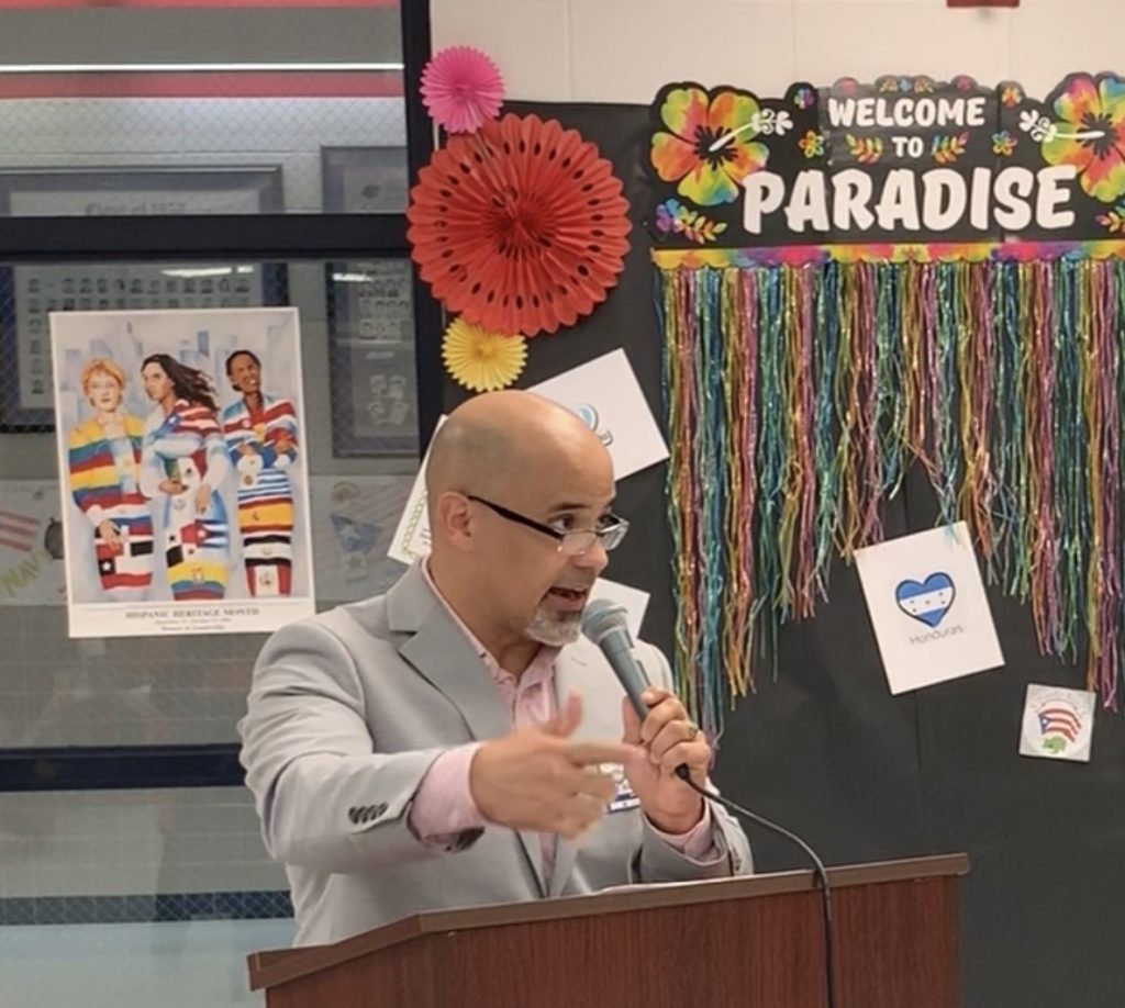 Dr. Javier Gomez speaking at an Hispanic Heritage Month event