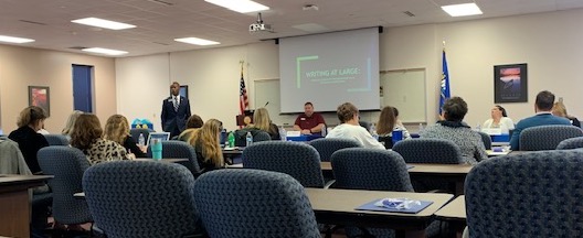 Dr. Cedric Bradley in meeting with high school faculty