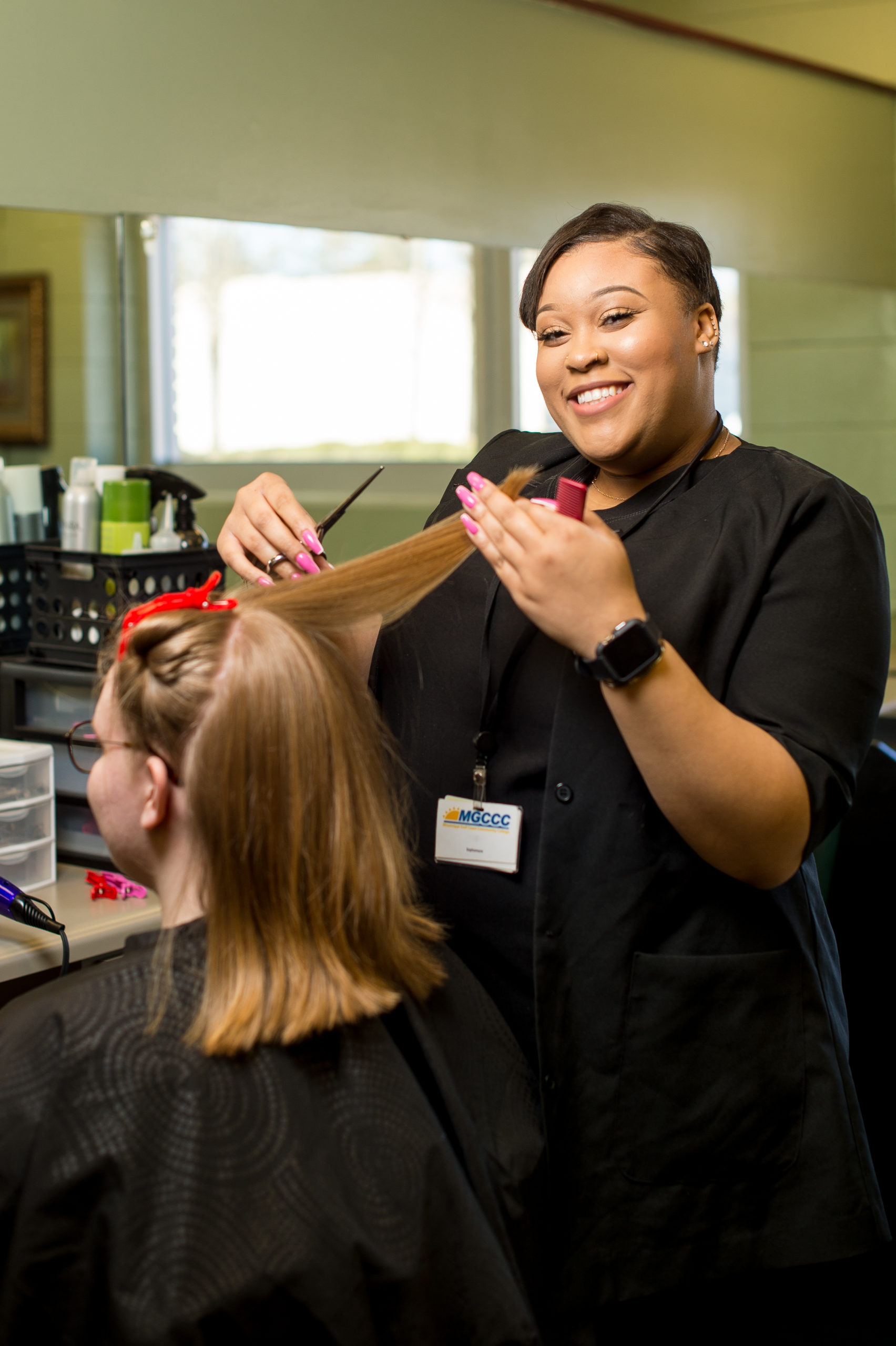 Cosmetology student cutting hair at MGCCC's George County Center