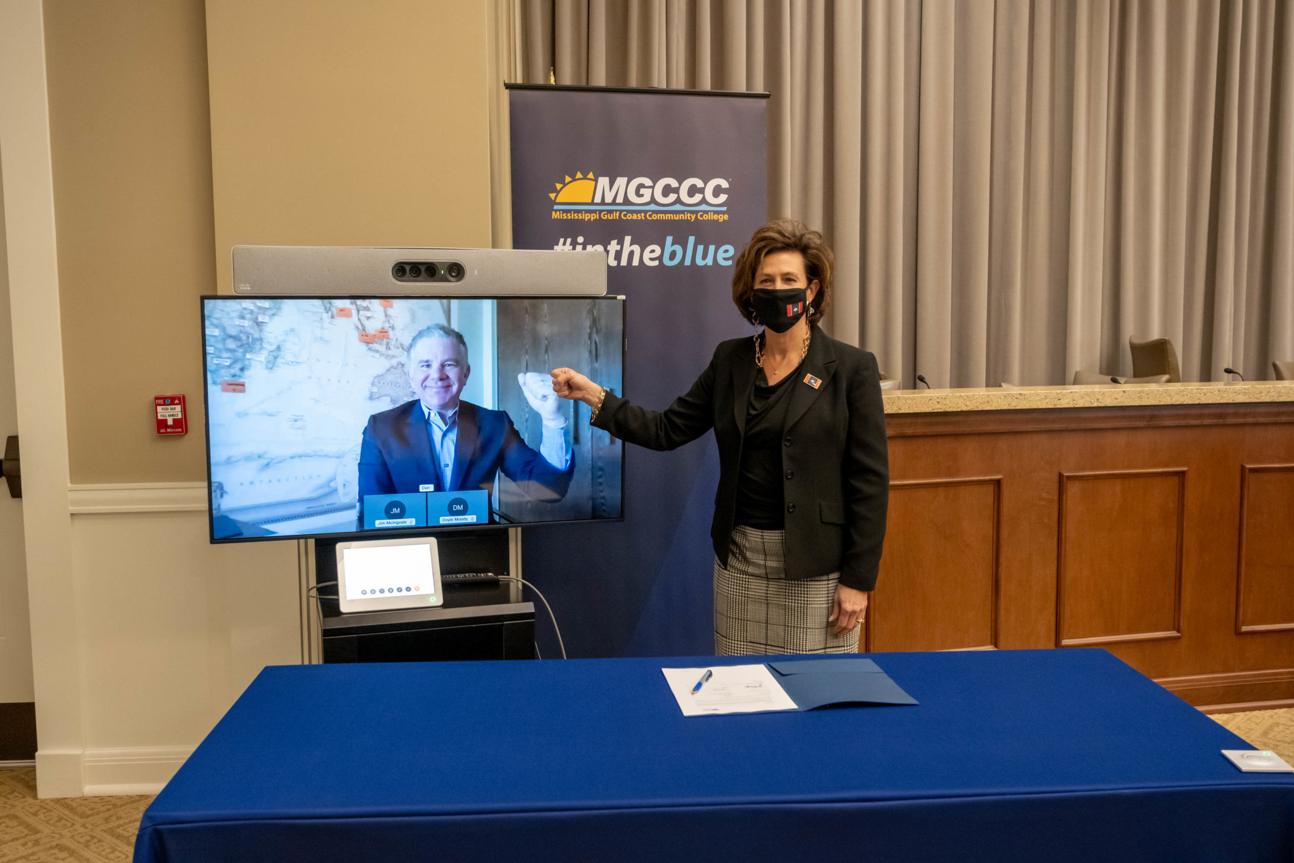 Dr. Mary Graham, MGCCC president gives a virtual “fist-bump” to Dan Lejerskar, founder of EON Reality, during their virtual signing meeting on Wednesday, January 13.