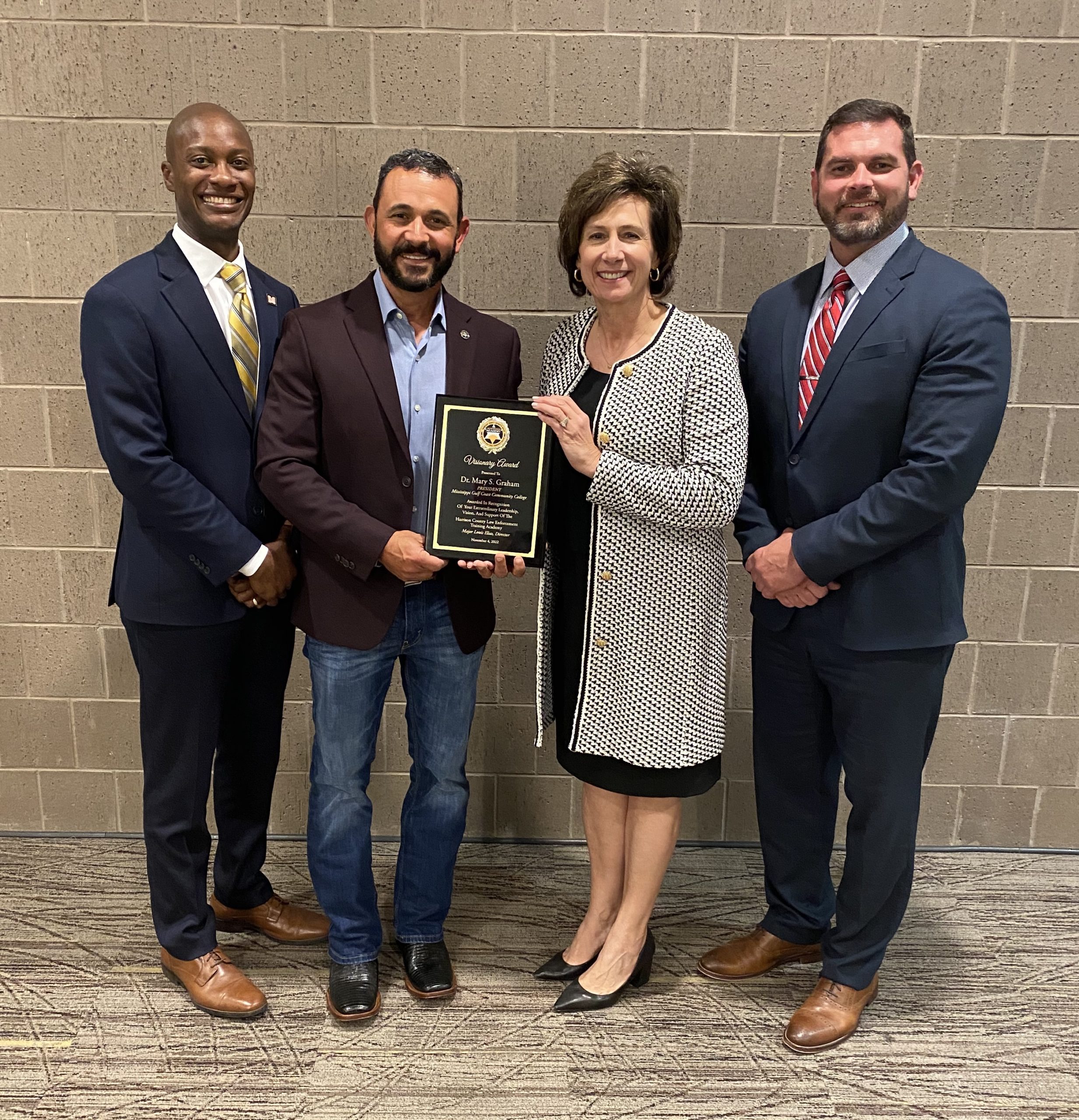 Pictured with the Visionary Award are from left Dr. Cedric Bradley, vice president of the Harrison County Campus; Major Louis Elias, director of the Harrison County Law Enforcement Training Academy; Dr. Mary S. Graham, MGCCC president; and Dr. Ladd Taylor, vice president of the Perkinston Campus.