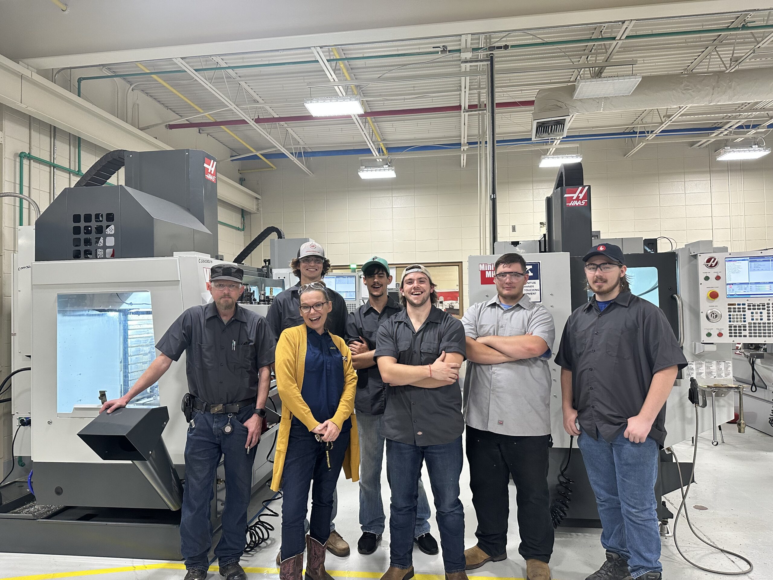 Instructor Jamie Wilkerson, center, with students in the Precision Manufacturing and Machining Technology program at MGCCC’s Jackson County Campus. These students are receiving tuition assistance, help with book costs, and a toolbox with tools as part of a $10,000 scholarship Wilkerson received from the Gene Haas Foundation.