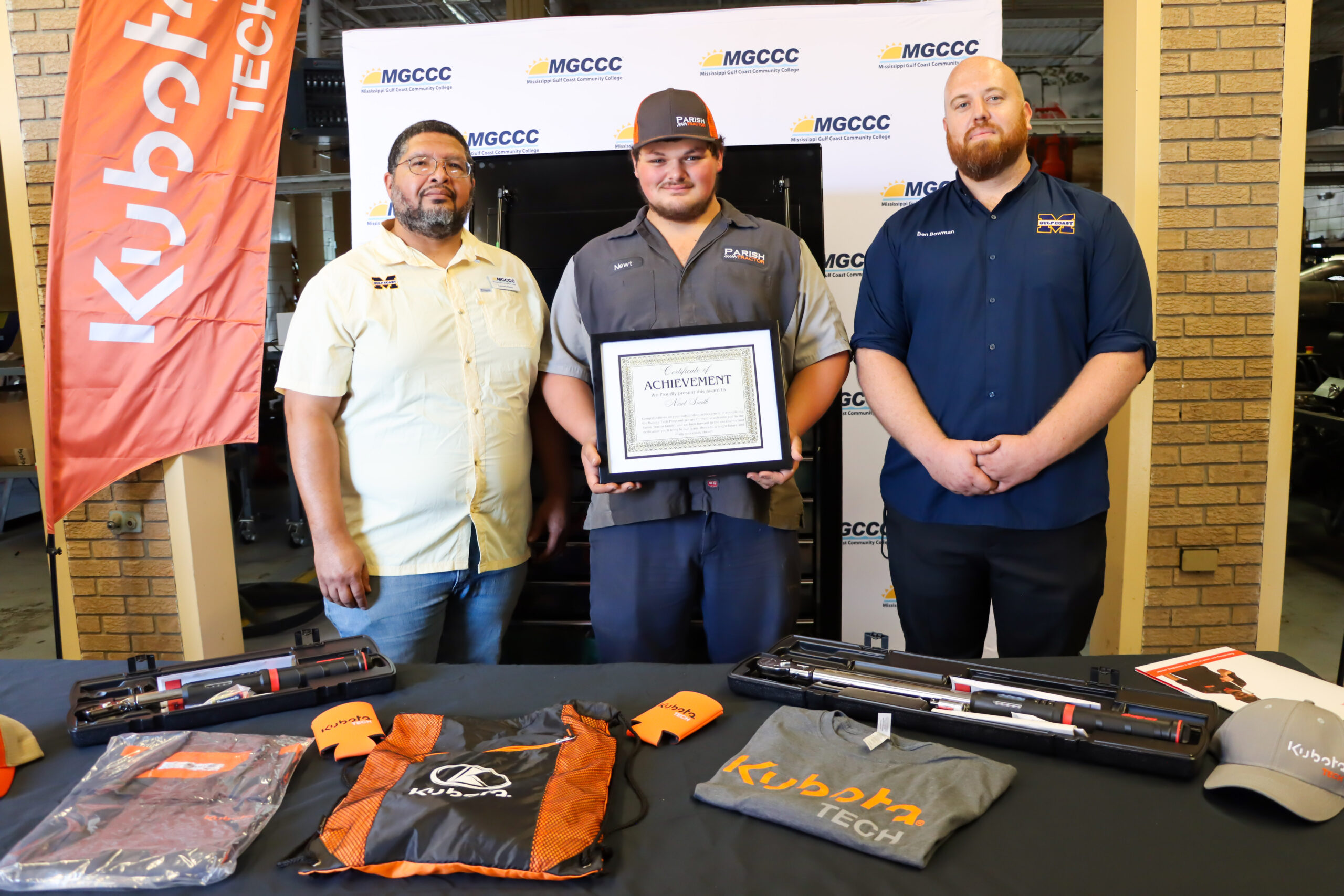 MGCCC student Newt Smith, center, with instructors Lamont Davis, left, and Ben Bowman, right.