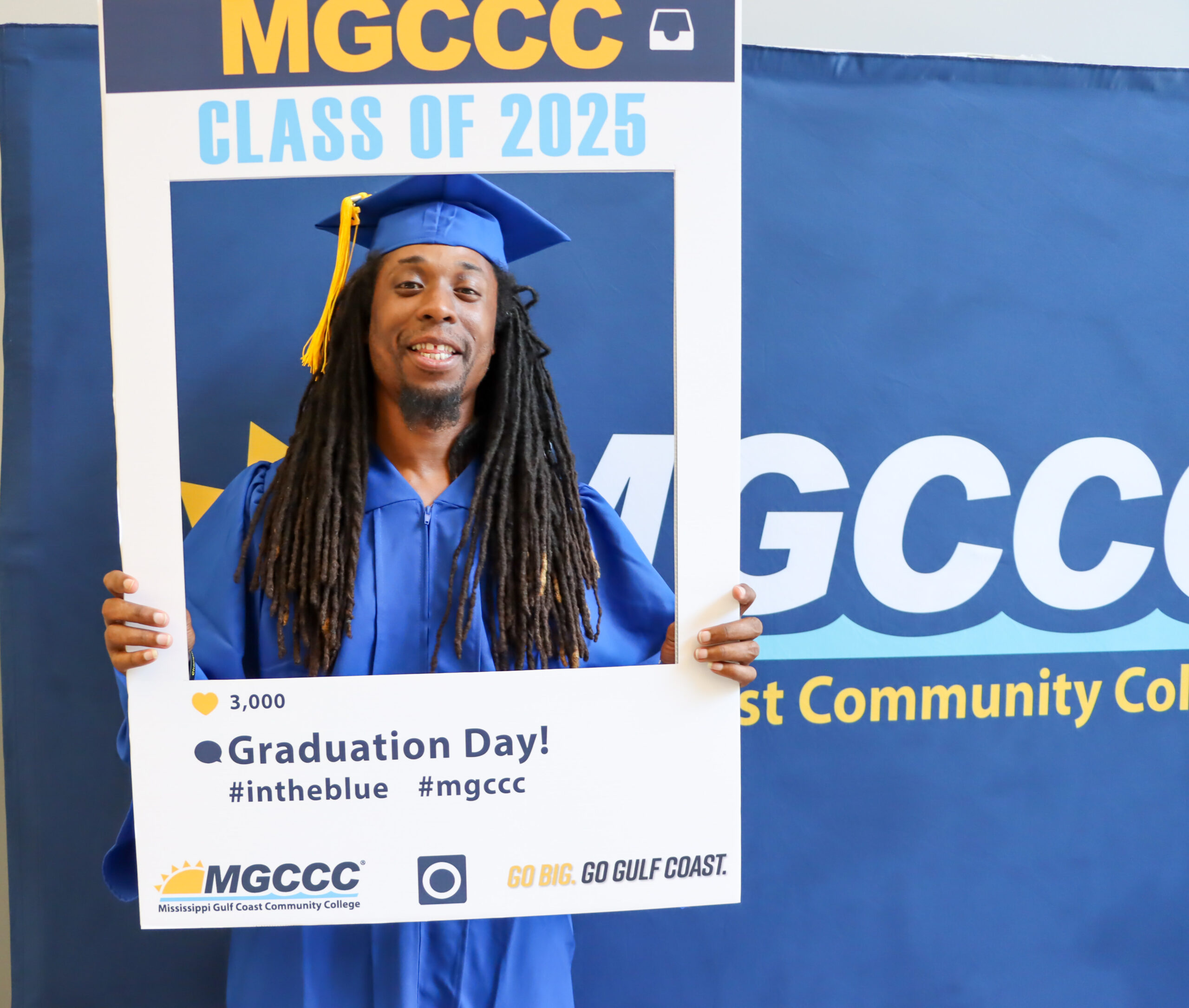 Arthur Minor at Adult Education Graduation in May 2025 standing in a large photo frame smiling.
