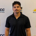 Ivan in front of an MGCCC backdrop.