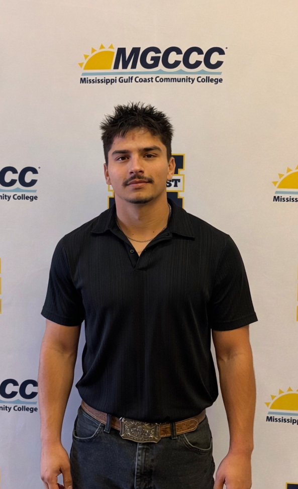 Ivan in front of an MGCCC backdrop.