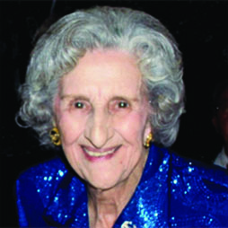 Color portrait of Clare Sekul Hornsby as an older woman with gray hair wearing a blue dress.
