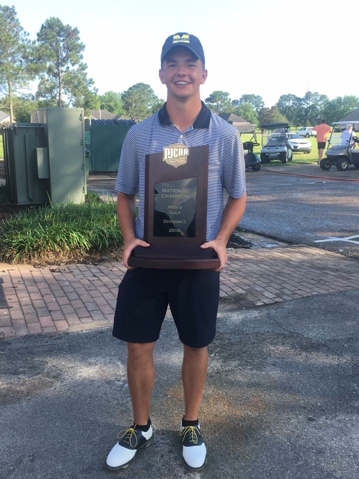 Colby Entriken holding the national trophy