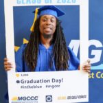 Arthur Minor with photo frame at adult education graduation