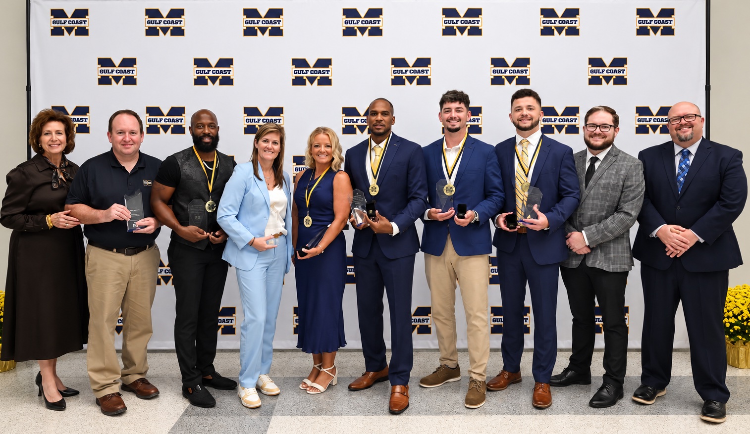 Athletic Hall of Fame Honorees: From left are MGCCC President Dr. Mary S. Graham; Kyle Clark, Spirit of Gulf Coast honoree; Dantrell Savage, Athletic Hall of Fame honoree for football; Dana Sharp, Bulldog Hall of Honor honoree; Lea Kittrell, Athletic Hall of Fame honoree for softball; Don Jones II, Athletic Hall of Fame honoree for football; Brandon Parker, Athletic Hall of Fame honoree for baseball; Colby Entriken, Athletic Hall of Fame honoree for golf; Dean of Athletics Steven Campbell; and Dr. Brad Bailey, vice president of the Perkinston Campus.